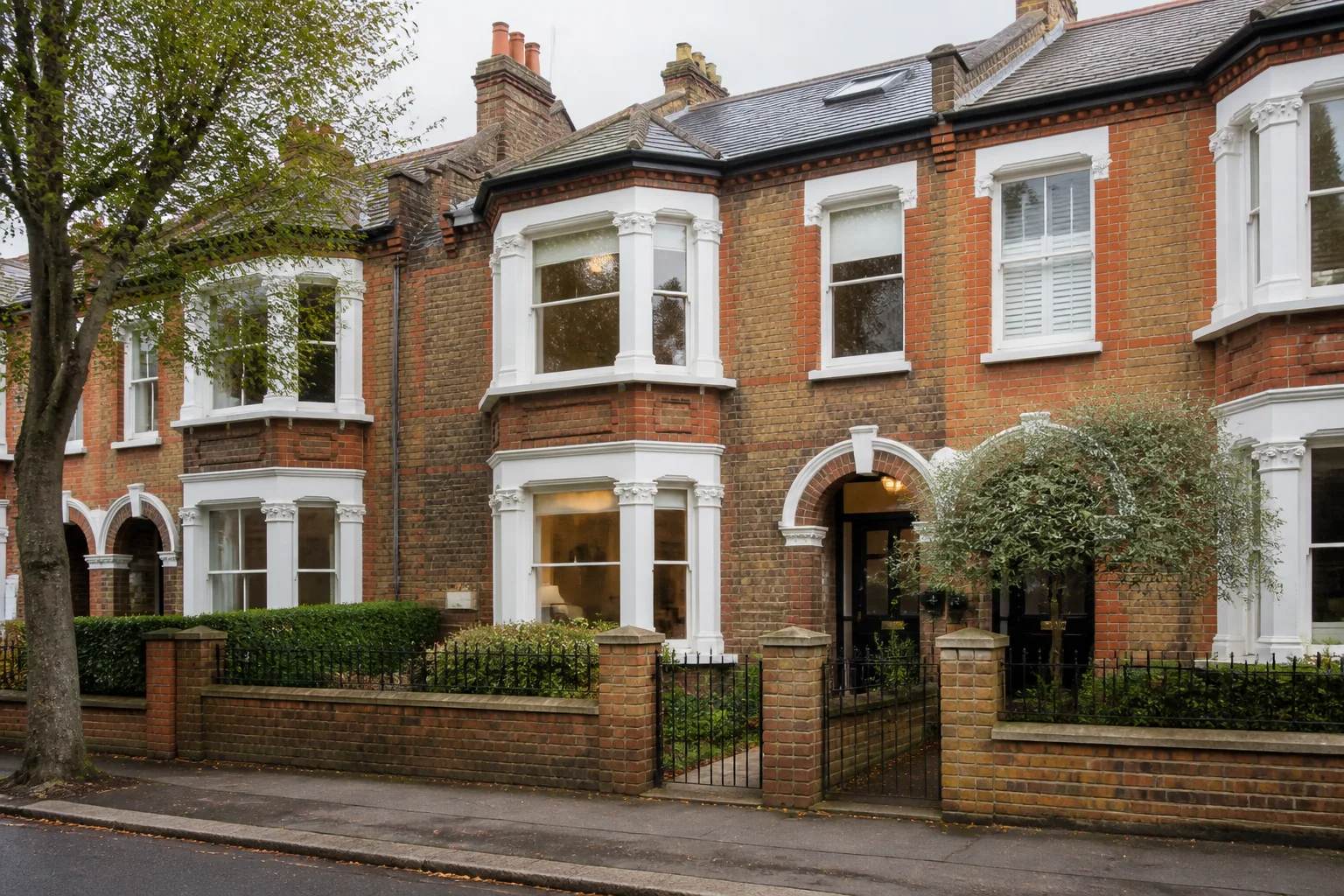 Red-brick Victorian terrace house on a British residential street
